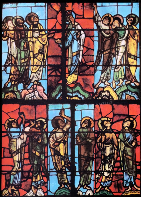 Stained glass window from le mans Cathedral, France. Shows The Virgin Mary with the Apostles