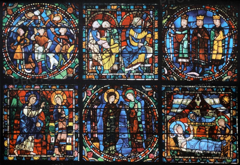 Stained glass window from above the main entrance to Chartres Cathedral, France. Shows the life of Christ: