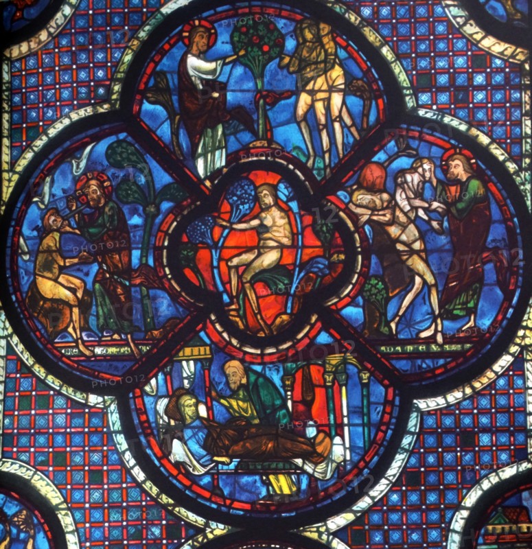 Stained glass window from Chartres Cathedral, France. Shows the story of Jesus and the good Samaritan