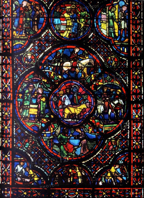 window from Bourges Cathedral, France. Shows the parable of the prodigal son;