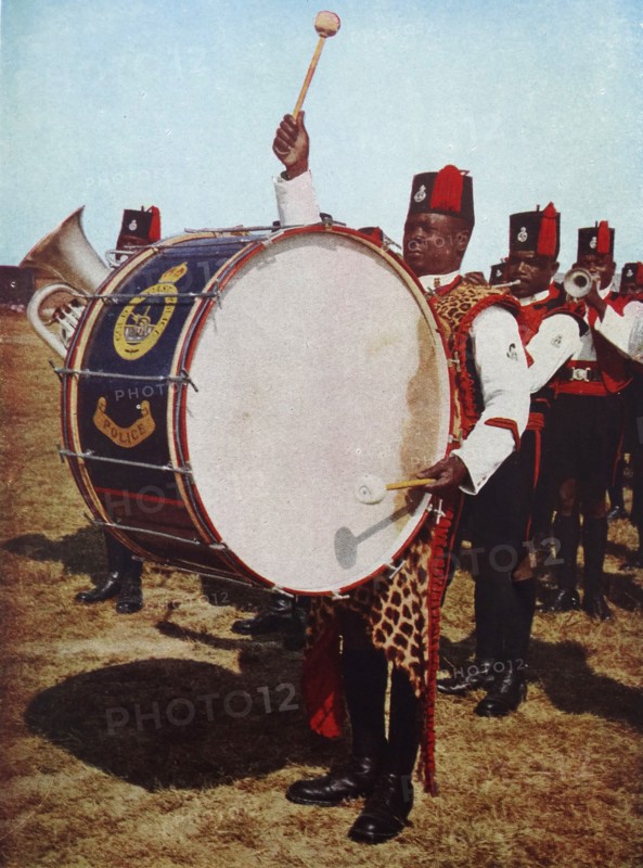 Colour photograph of Salifu Konkomba playing the big drum in the famous band of the Gold Coast Police