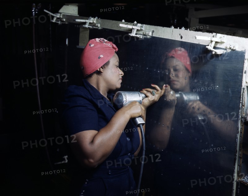 World war two: Woman Operates a hand drill at Vultee-Nashville, working on a 'Vengeance' dive bomber, Tennessee