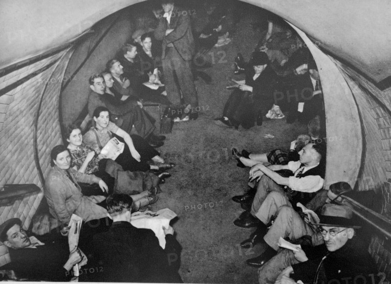 Civilians take shelter in a London Undergroud rail station during the air raids of the German Blitz 1940