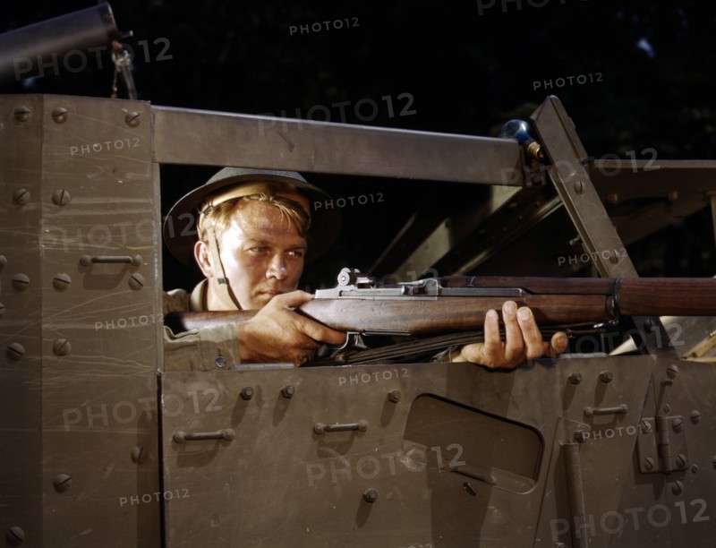 Colour photograph of an infantryman with a Garand rifle