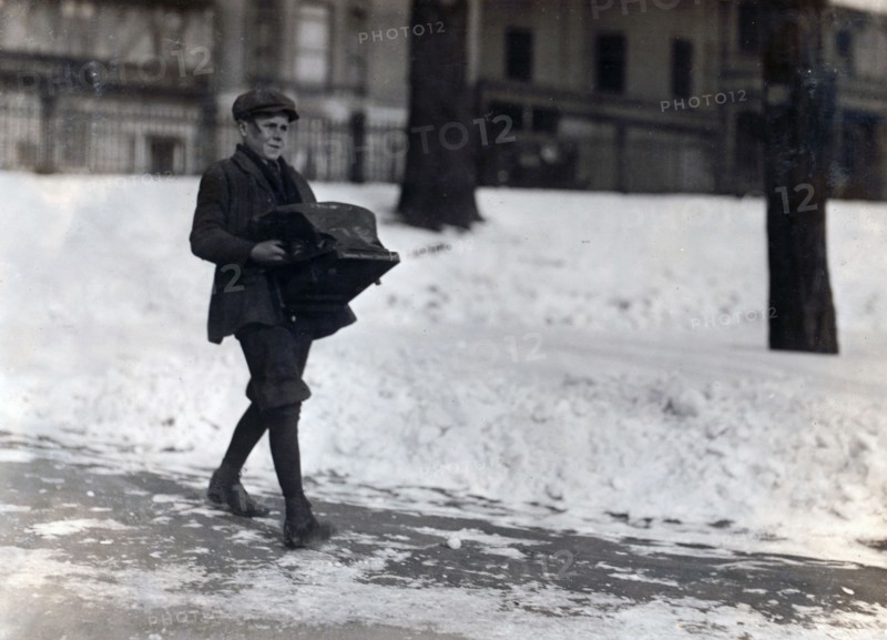 Boy delivering a typewriter
