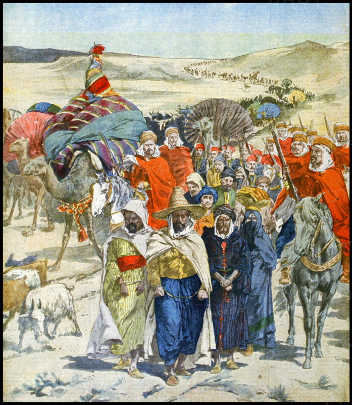 A Razzia or slave raid in caravan formation passing through the Algerian Sahara desert, 1900