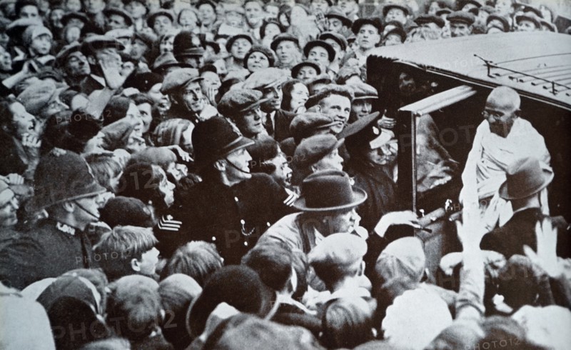 Mahatma Gandhi greeted by well wishers as he arrives in London in 1931, during his tour of England