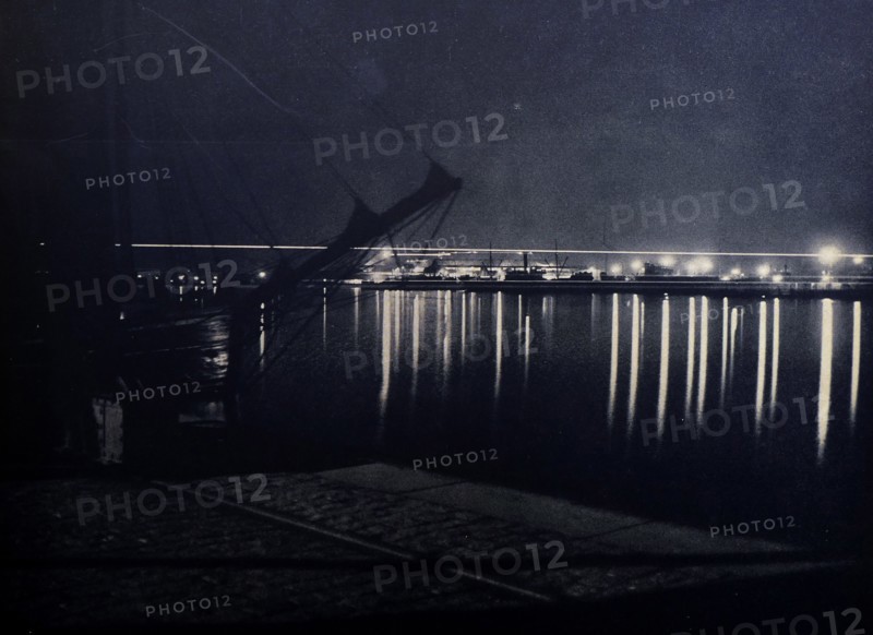 Kiel Harbour, in Germany, at night circa 1930 by Carl Boss