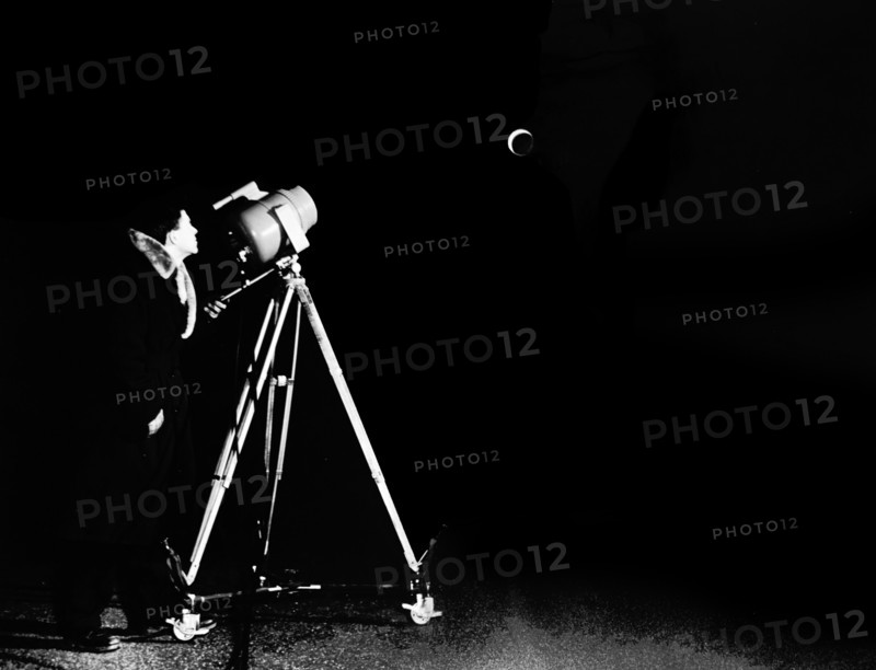 Photograph of an astronomer using a Barnes Engineering Company Radiometer, used for infrared temperature detection of the moon surface