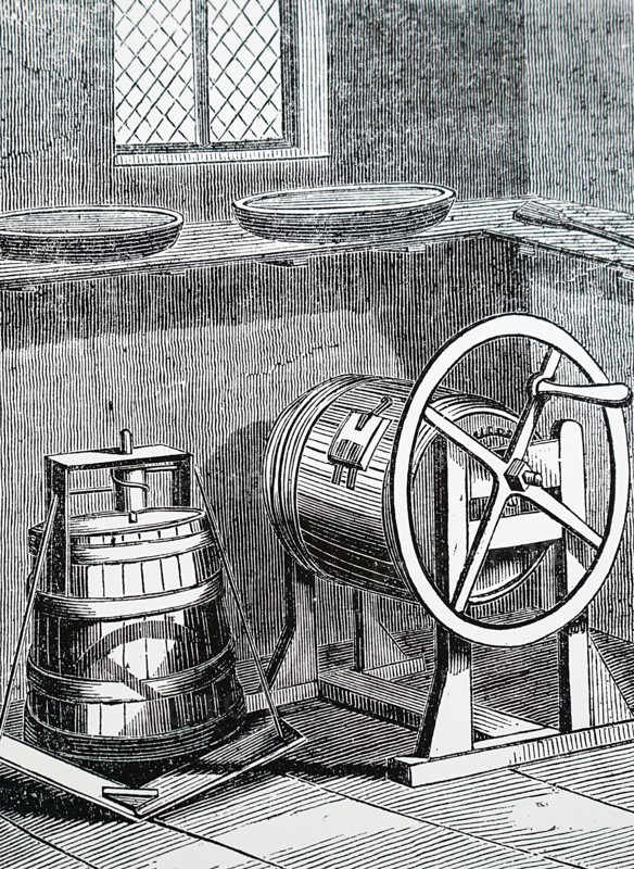 A vertical treadle butter churn