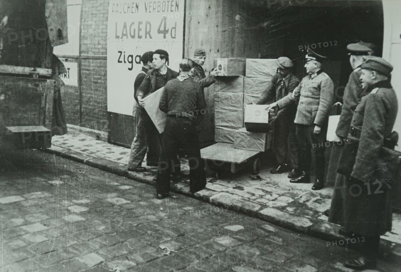 Photograph of supplies being loaded into a German Army store in Paris, during the Invasion of France in 1940 in World War Two
