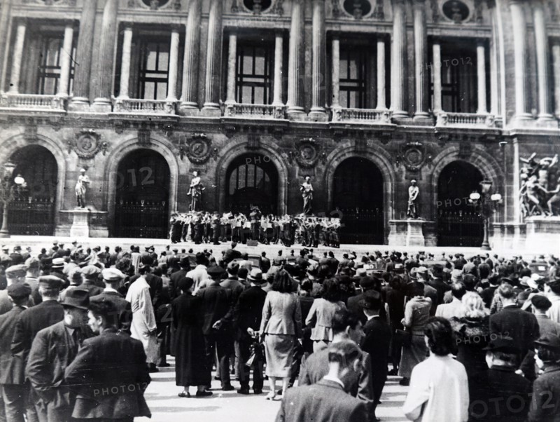 Photograph of Nazi soldiers singing in front of a Church in Paris, during the German occupation of France, in World War Two
