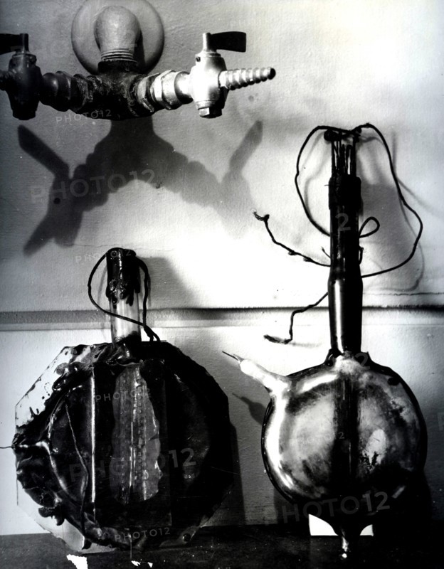 Photograph of the first two cyclotron models designed by Ernest Lawrence