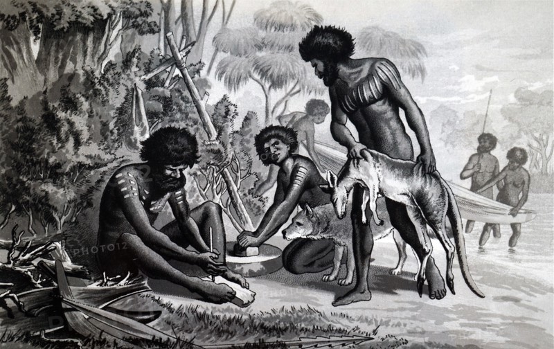 Australian aborigines preparing a meal using a bow drill a prehistoric form of drilling tool, which was used to produce fire