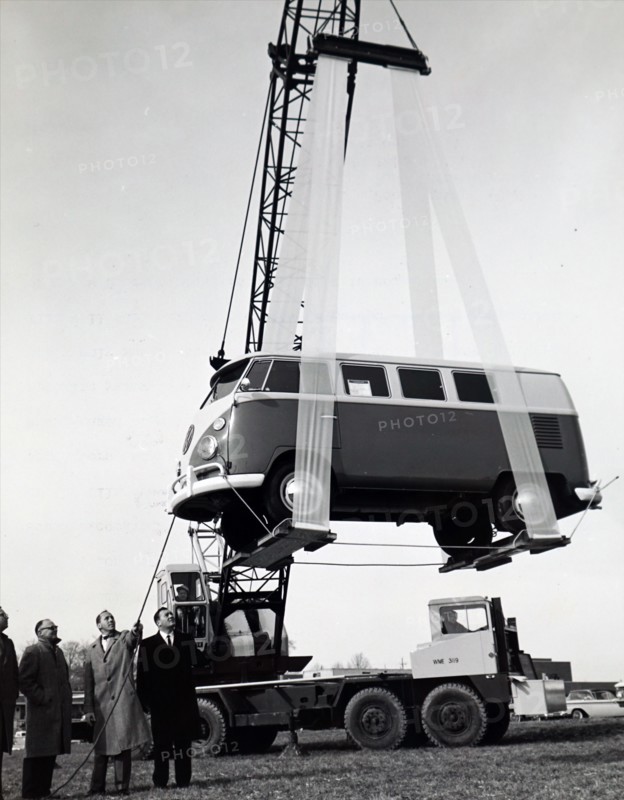 Photograph taken of a Volkswagen van being lifted into the air by a sling made from the 'Mylar' T polyester film