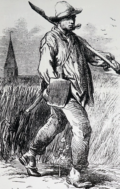 A French labourer walking with some tools