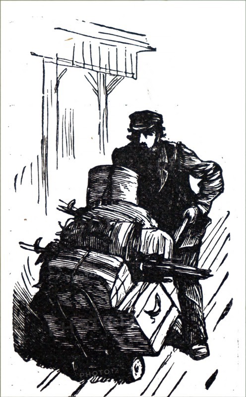 A station porter transporting heavy luggage to the train