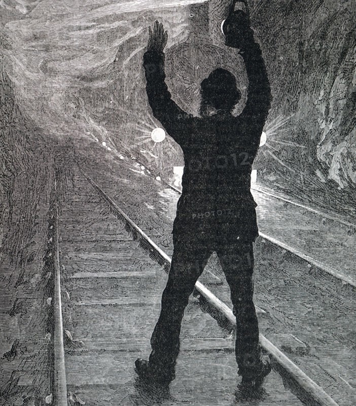A man trying to stop a train during an emergency