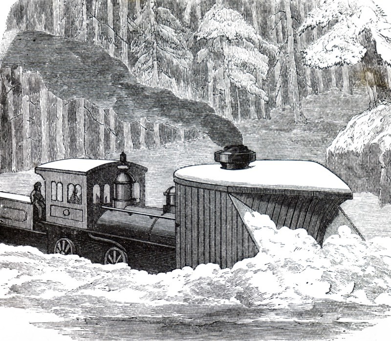 A locomotive snowplough being used to clear a snow drift in Canada