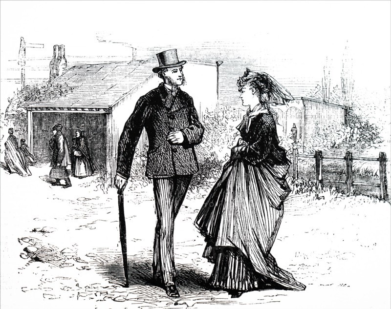 A couple outside of a country railway station