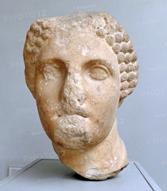 Head from a colossal statue of a woman wearing a sakkos (cap)