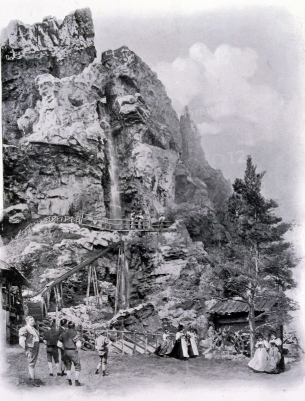 Photograph of a Swiss Village exhibit with waterfall.