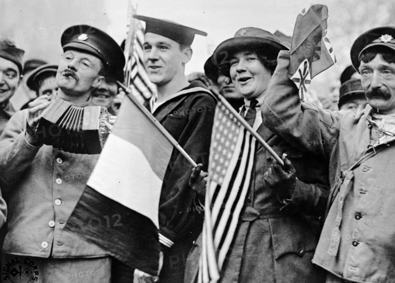 US and British soldiers, celebrating the armistice which marked the end of World War I on November 11th, 1918