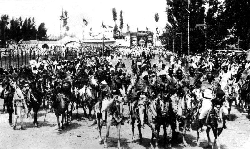 Ras,  tribal chieftains and warriors leaving Addis Ababa for the front, accompanied by the imperial  guard
