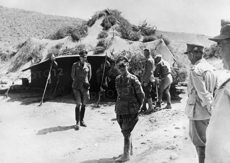 Rommel, Erwin 1891-1944
officer (gen.field marshall), gemany
commander of afrikacorps feb1941-march43
Col.Gen. Rommel in 2.WW in northafrica (cyrenaika) during the offensice direction Ghazala - at a visit to the italian gen. Navarini's HQ.
May/June 1942