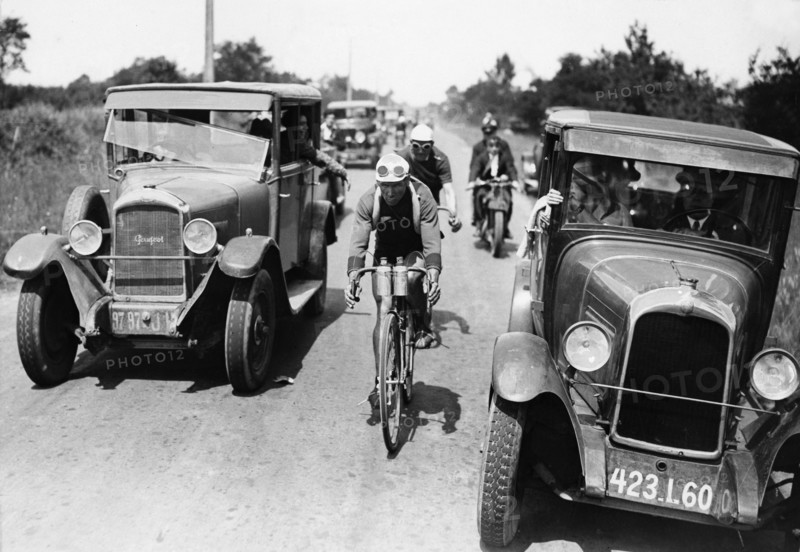 Cycling Tour de France: A cyclist with escort cars - 1930 - Vintage property of ullstein bild