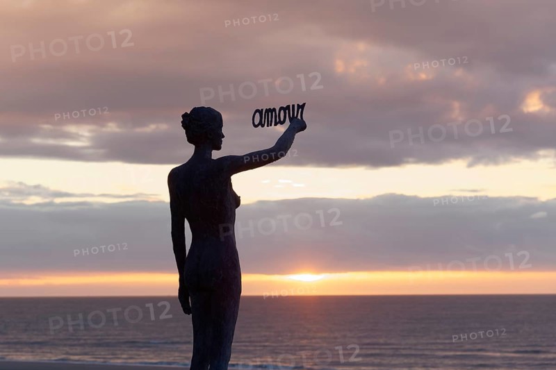 Woman writes French word Amour