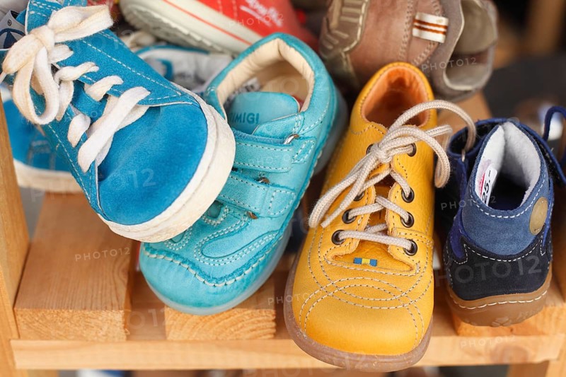 Children's shoes in a shelf