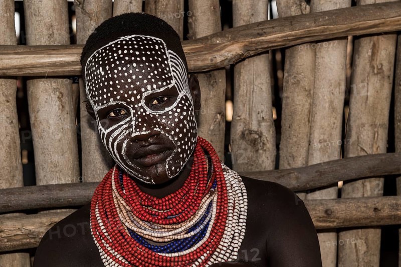 Young woman with painted face