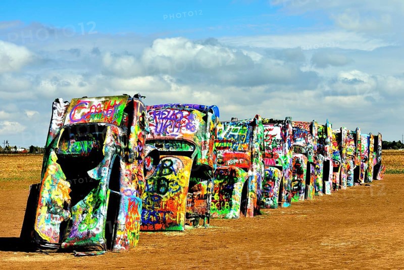 Painted Cadillacs rammed into the ground