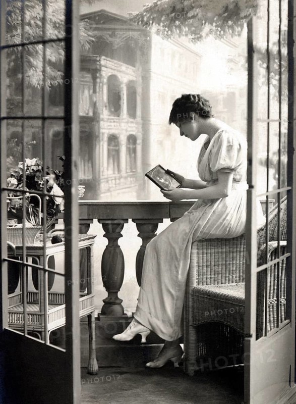 Woman longingly holding a picture of her man