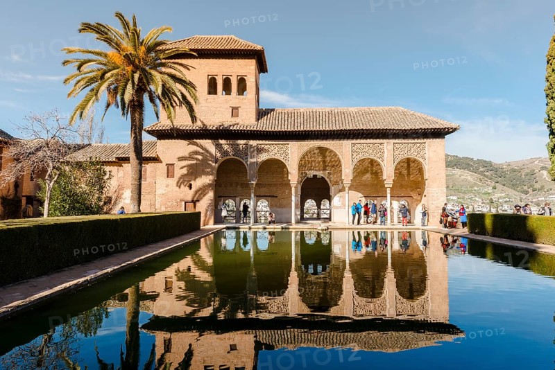 Antique Building El Partal with pool and palm trees