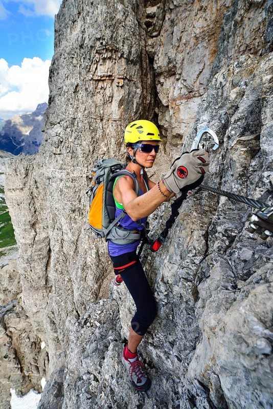 Female climber in the ladder at the Toblinger Knoten