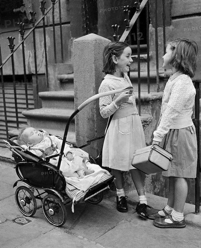 Two girls with baby