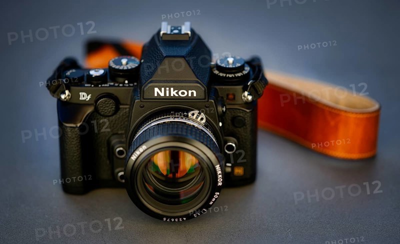 DSLR Nikon Df with Nikkor AI-S 50mm 1.2 in retro style