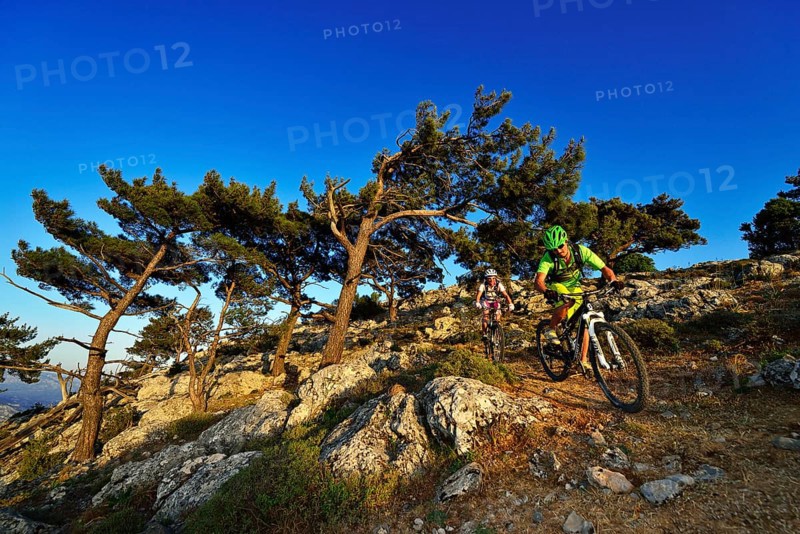 Two mountain bikers on a rocky