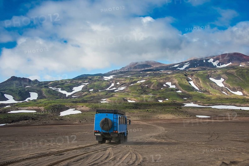 Truck driving through the lava sand