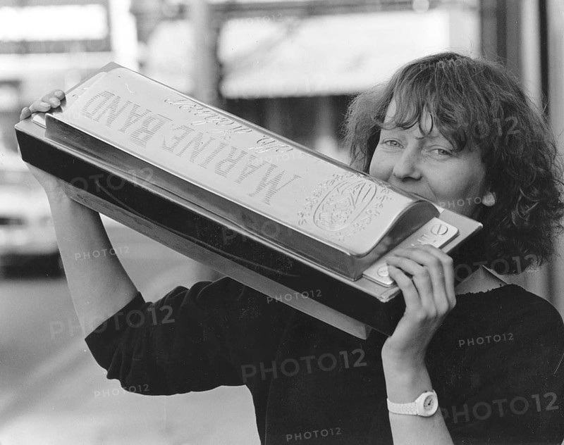 Woman with large harmonica