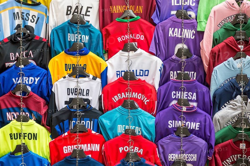 Football jerseys with names of football players for sale at sales stall