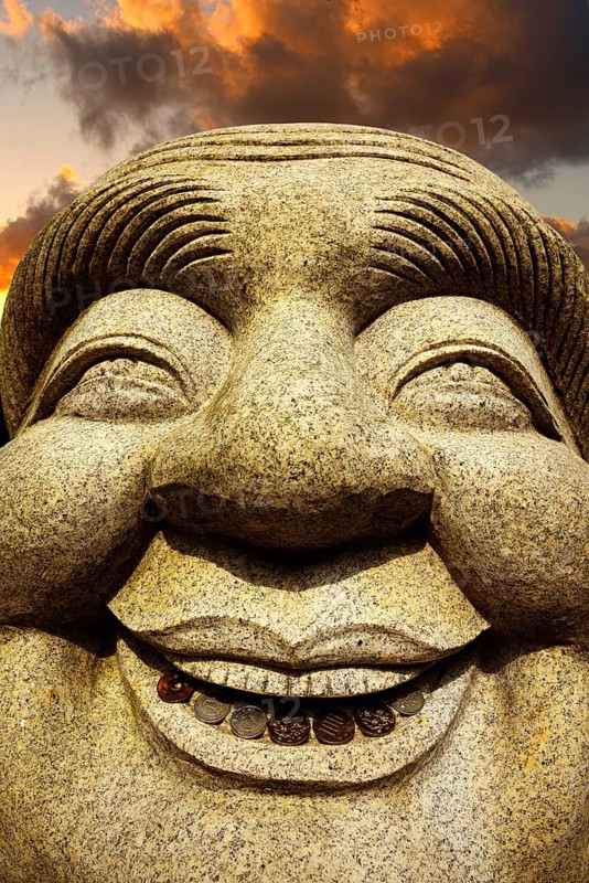 Ebisu Buddha with coins in his mouth