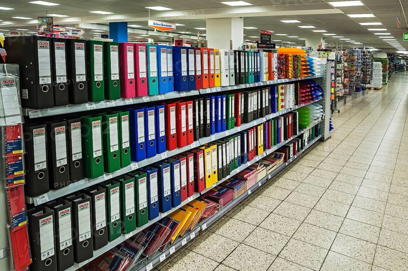 Shelf with office supplies in a supermarket