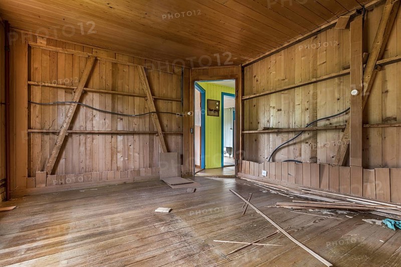 A room paneled with wood in a house that will be demolished