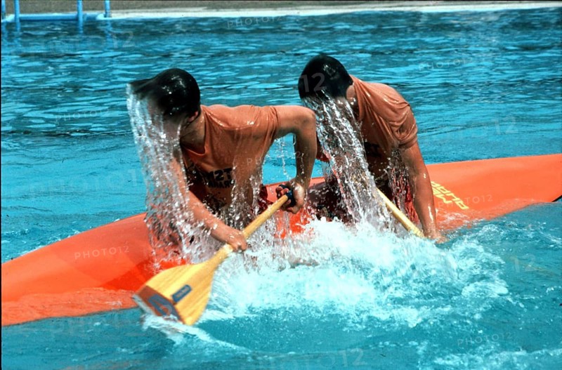 Two wet paddlers in a kayak ca. 1970s