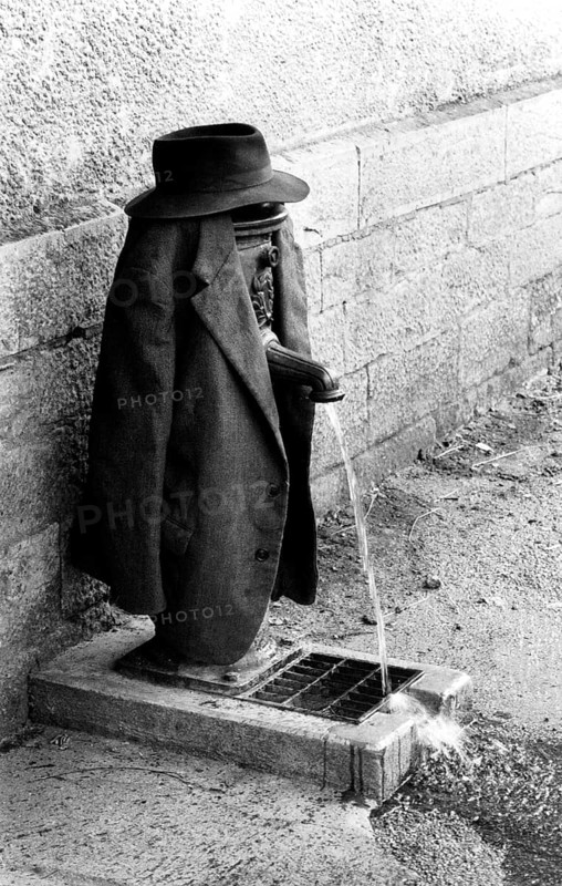 Tap as clothes rack for jacket and hat