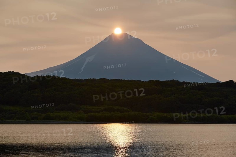 Sunrise over the summit of the Ilyinsky volcano at the Kurilskoye lake