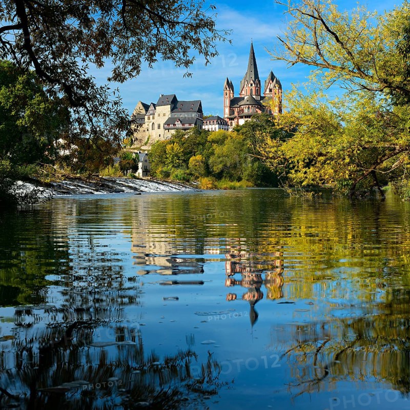 Limburg Cathedral St. Georg or Georgsdom and imburg castle over the river Lahn in autumn